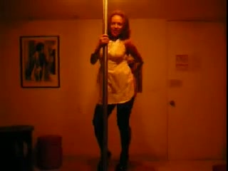 Black playful housewife on the pole trying to dance